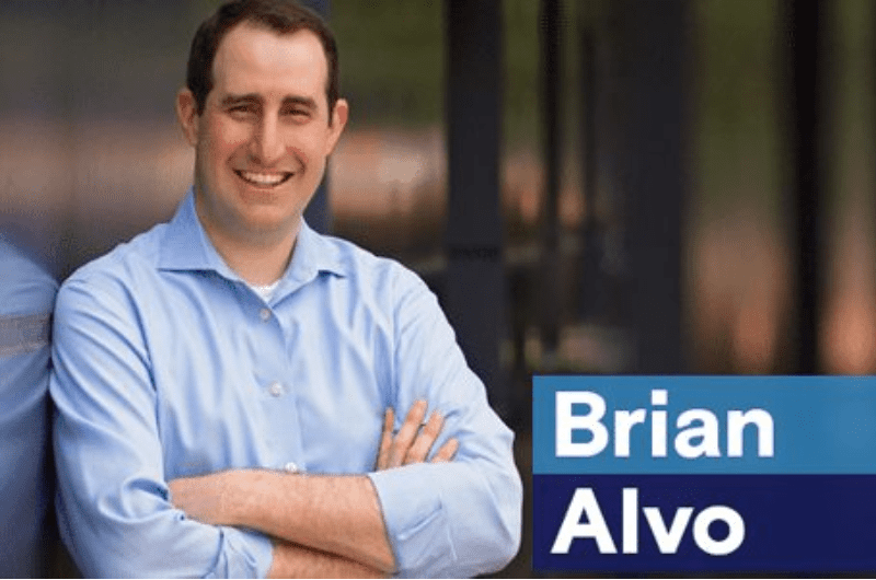 brian alvo a man with his arms crossed