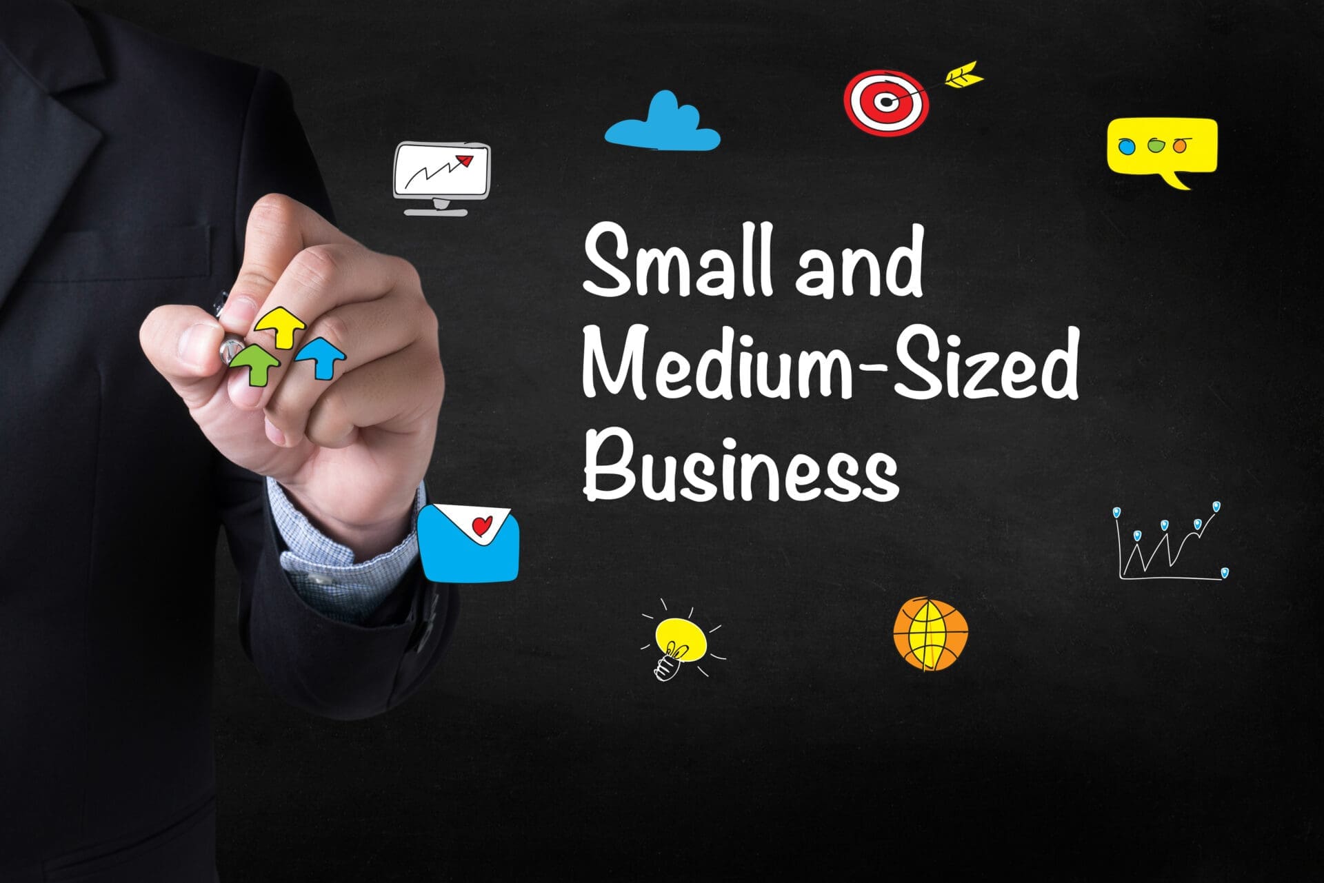A suited professional points to colorful business icons on a blackboard labeled “Small and Medium-Sized Business.